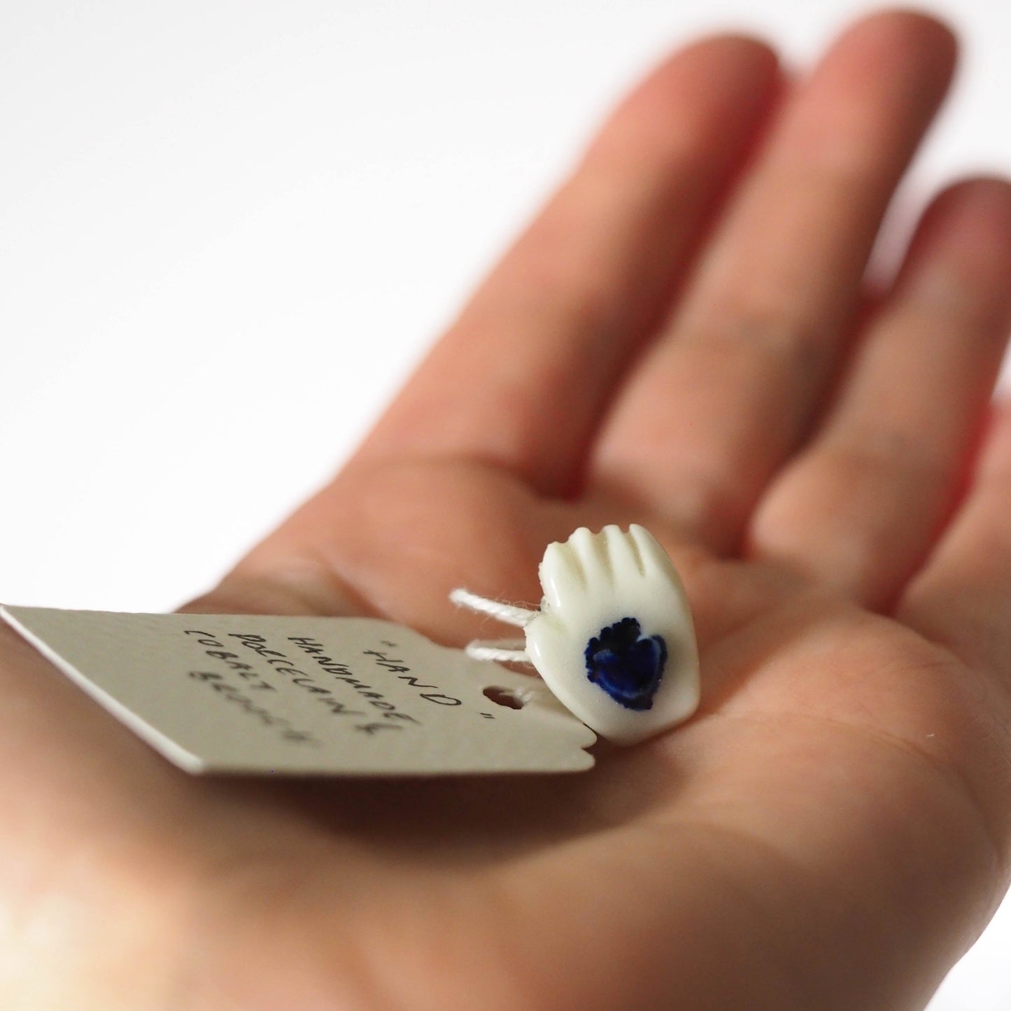 Tiny Porcelain Hand of Generosity Pin-on