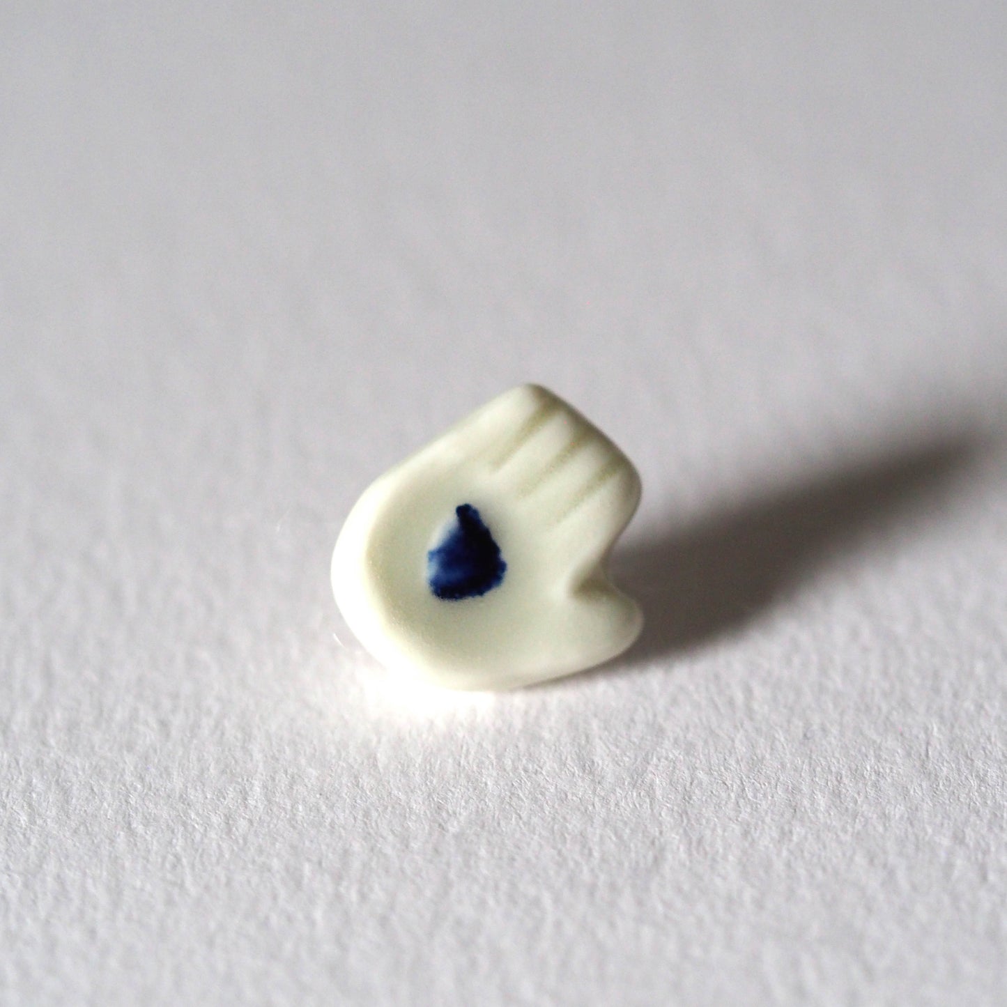 Tiny Porcelain Hand of Generosity Pin-on