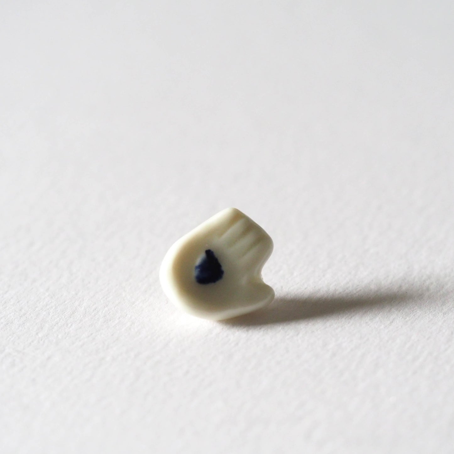 Tiny Porcelain Hand of Generosity Pin-on