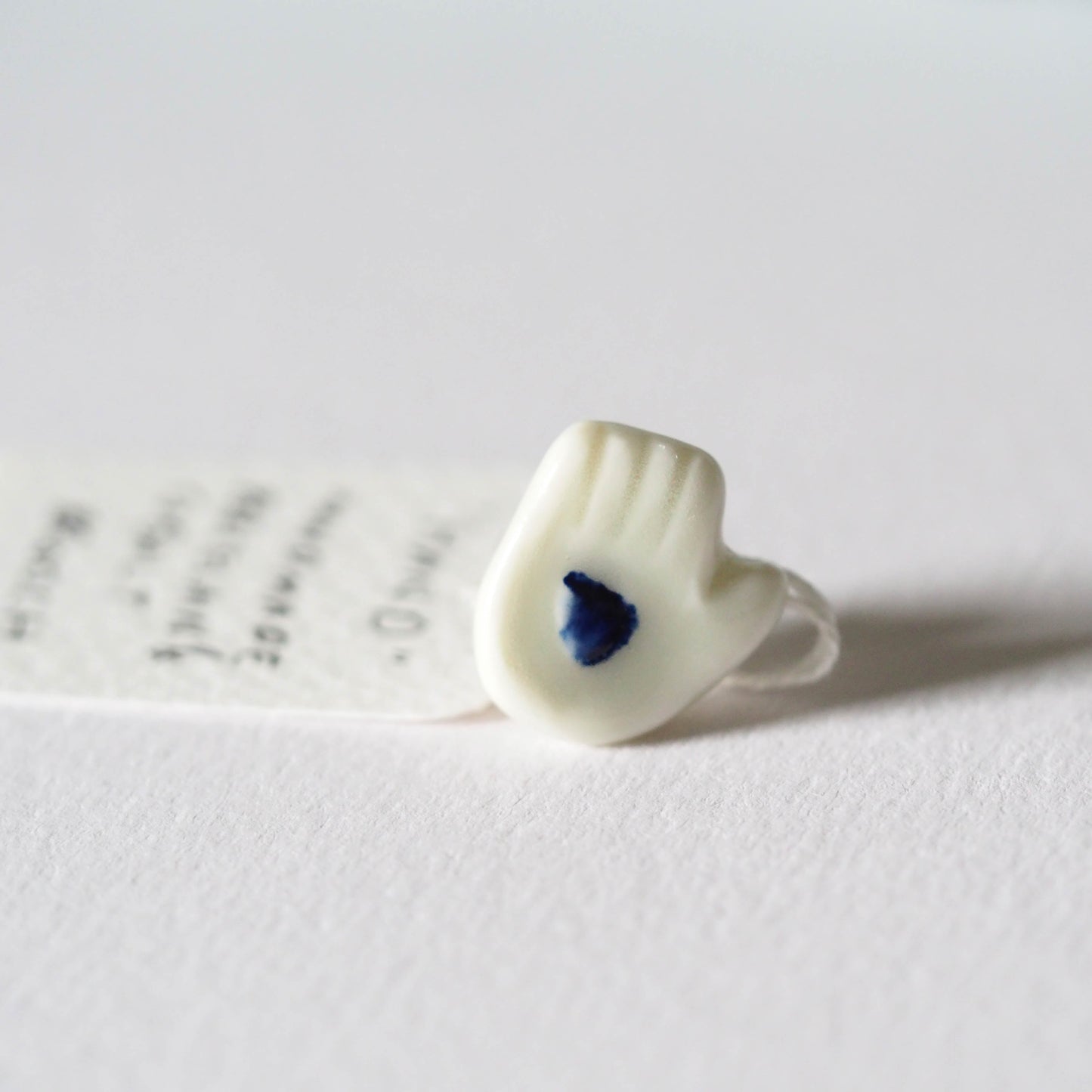 Tiny Porcelain Hand of Generosity Pin-on