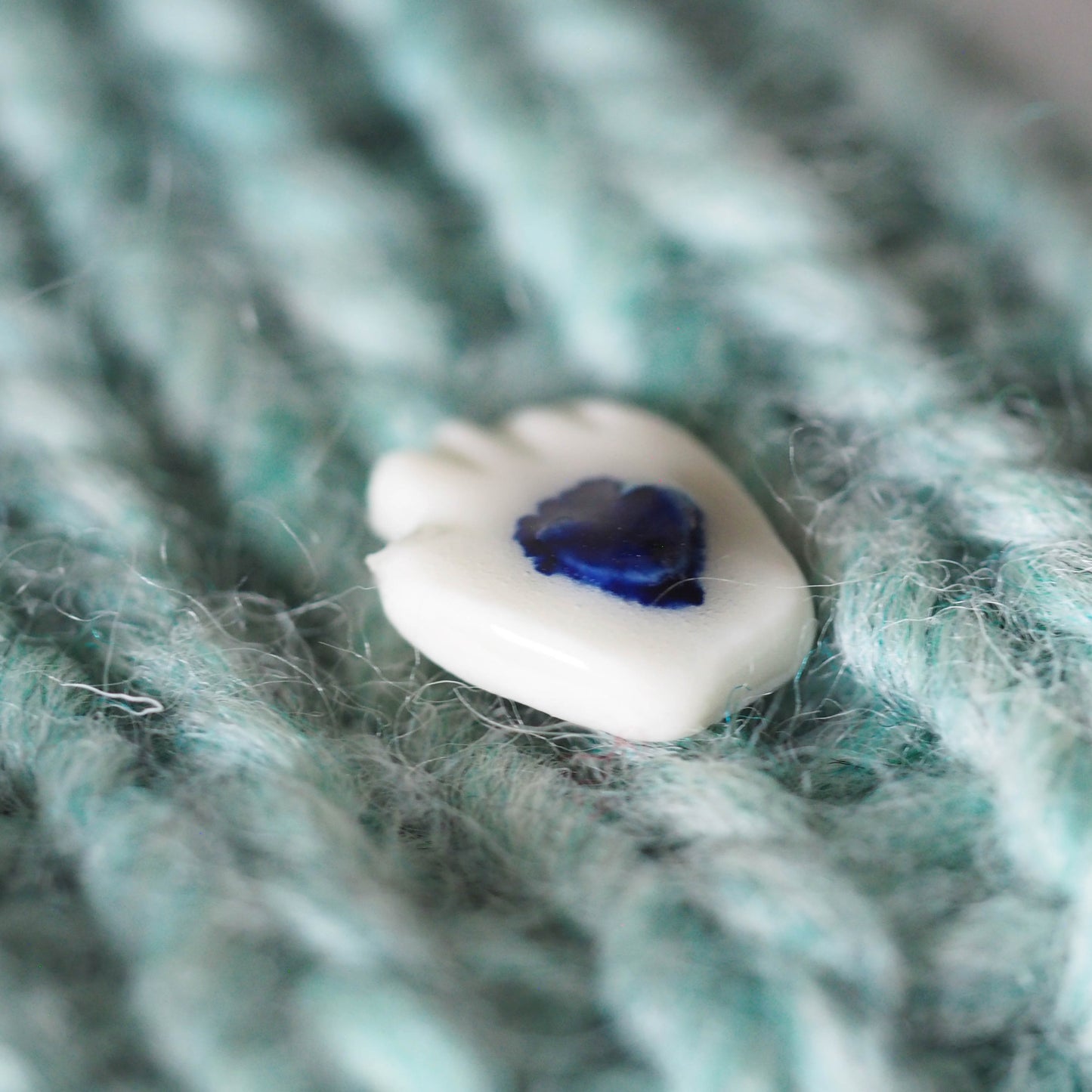 Tiny Porcelain Hand of Generosity Pin-on