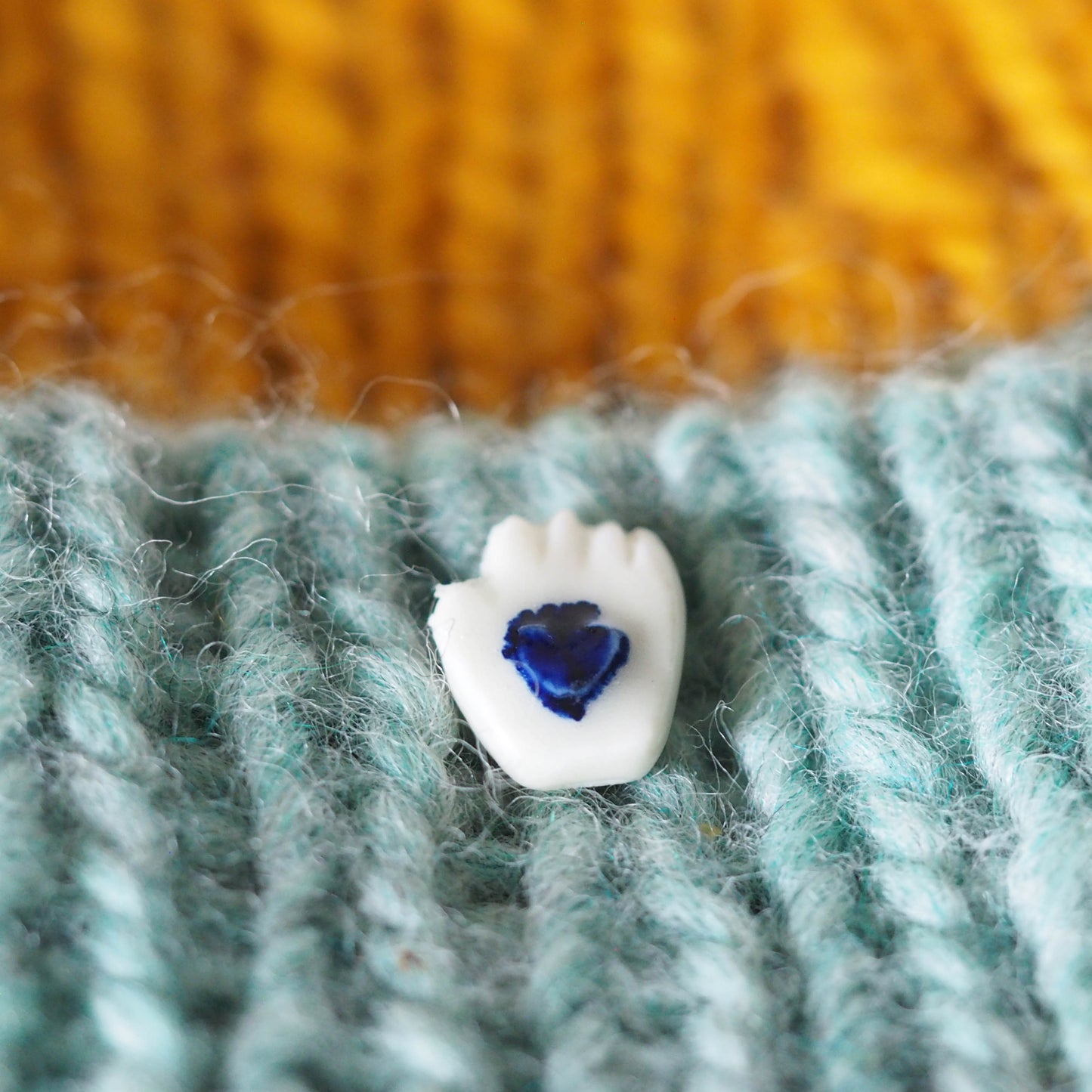 Tiny Porcelain Hand of Generosity Pin-on