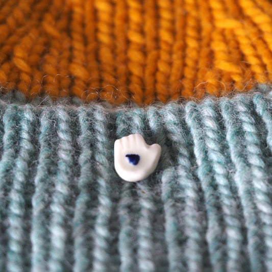Tiny Porcelain Hand of Generosity Pin-on