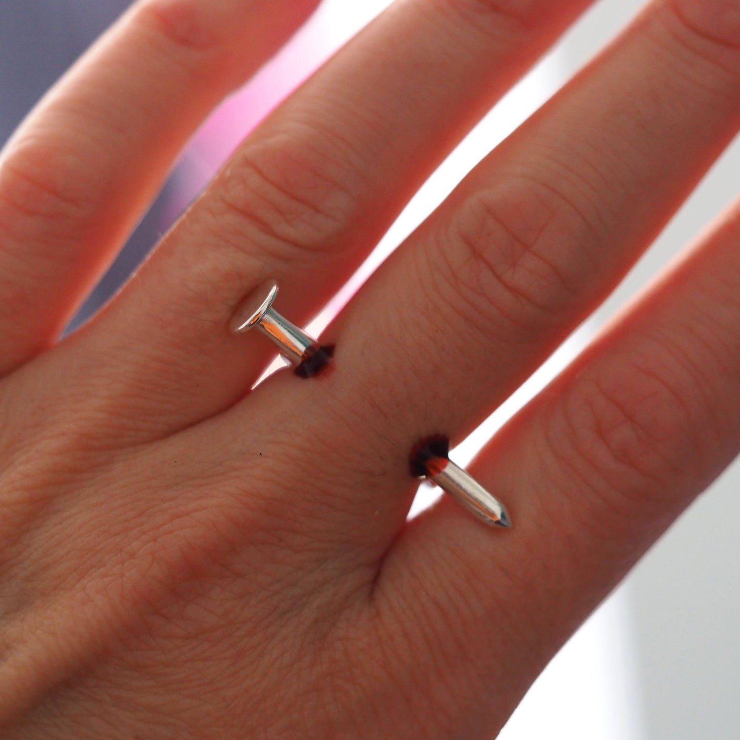 Nail Through Finger Ring